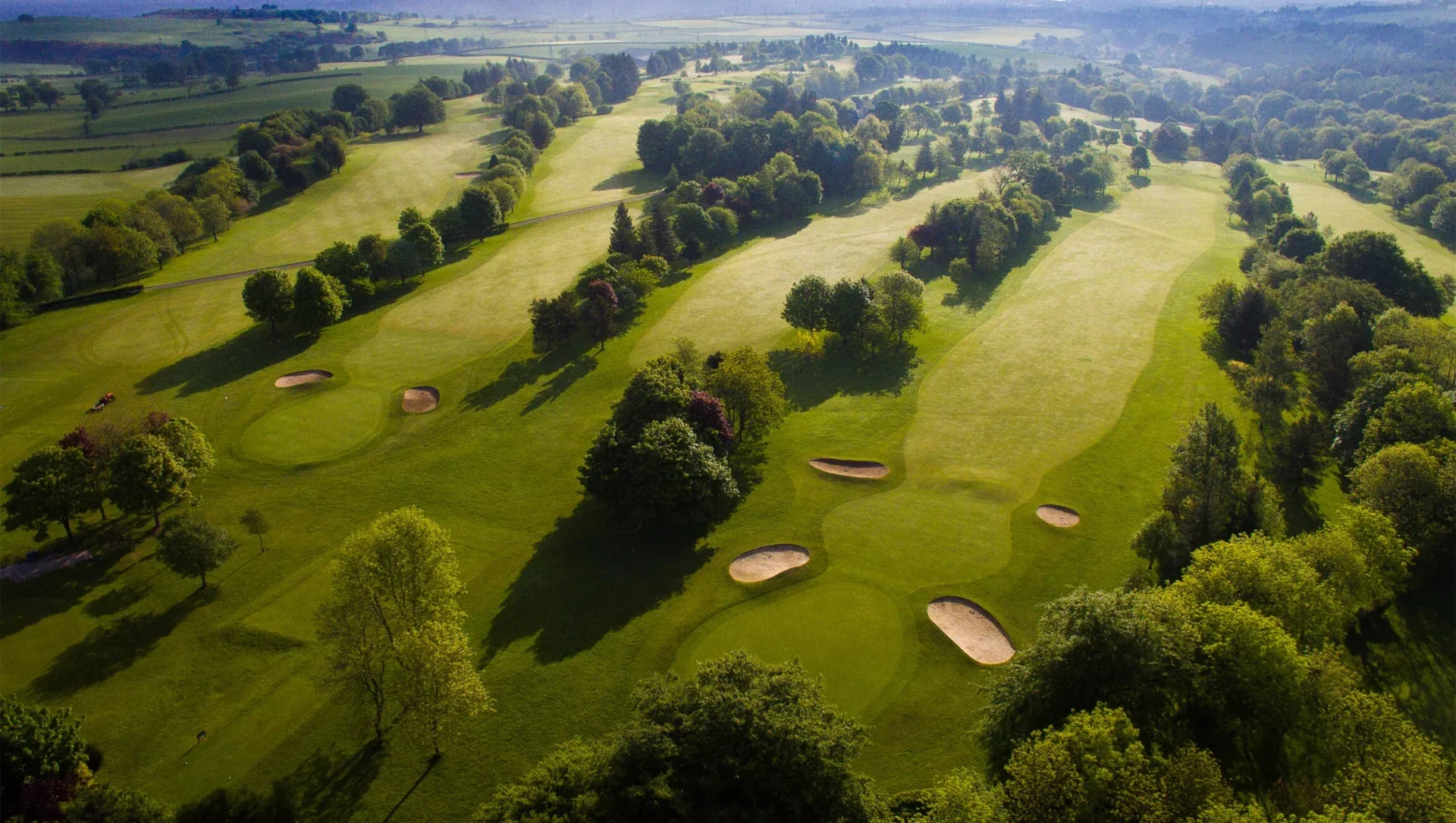 Aerial view of Strathaven Golf Club fairways and bunkers