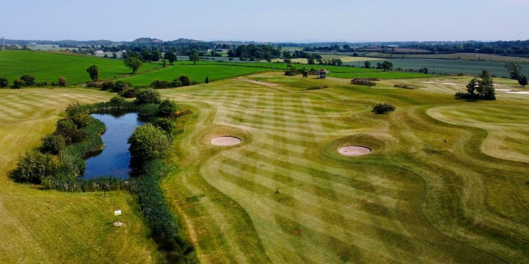 Kingsfield Golf course fairway with pond